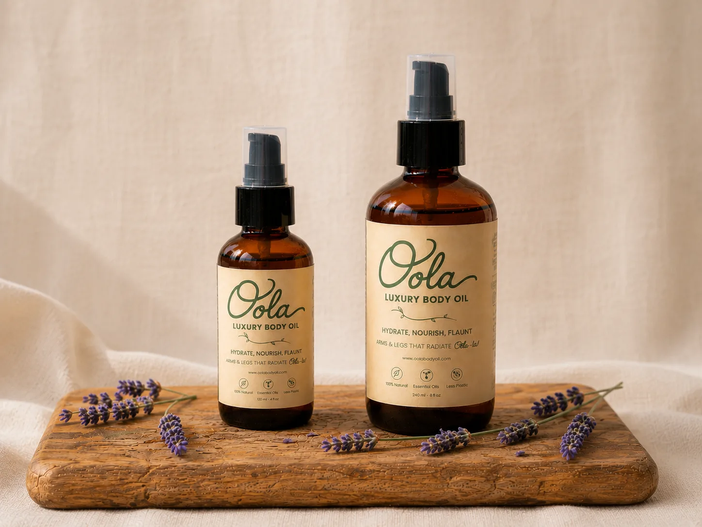 Oola Luxury Body Oil 4 oz and 8 oz bottles on a wooden board with fresh lavender