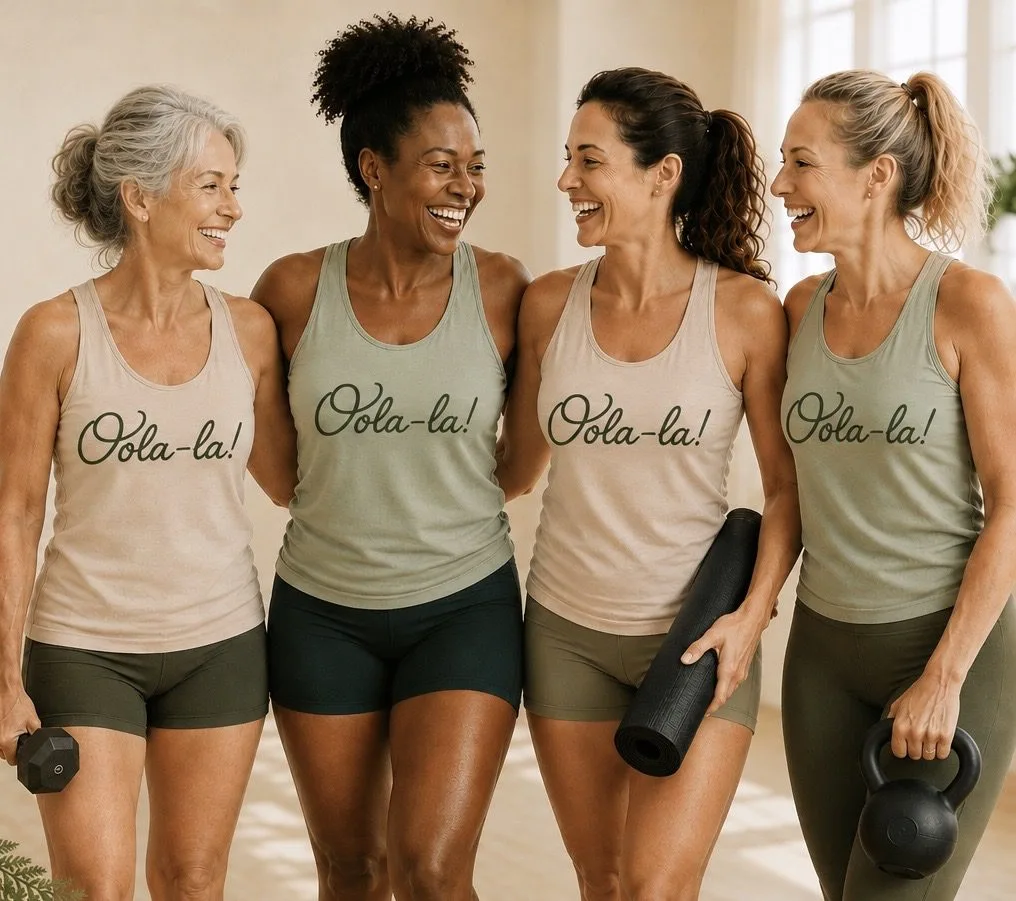 Four friends laughing together in matching Oola-la! tank tops